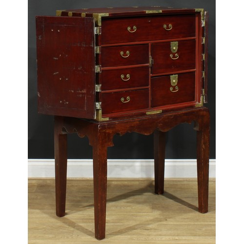 1022 - A Chinese brass mounted yumu and hardwood enclosed collector’s chest, flush rectangular top above a ... 