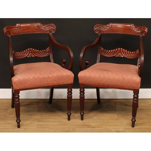 1396 - A pair of George IV mahogany bar-back desk chairs or carvers, each with a curved cresting rail carve... 