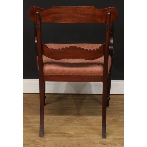 1396 - A pair of George IV mahogany bar-back desk chairs or carvers, each with a curved cresting rail carve... 