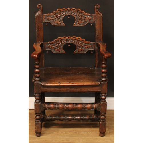 1118 - A set of eight Charles II design oak Derbyshire chairs, comprising six side chairs and a pair of car... 