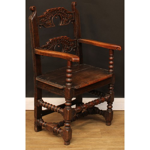 1118 - A set of eight Charles II design oak Derbyshire chairs, comprising six side chairs and a pair of car... 