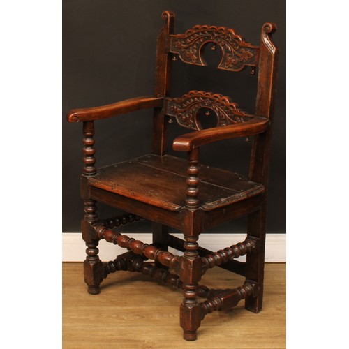 1118 - A set of eight Charles II design oak Derbyshire chairs, comprising six side chairs and a pair of car... 