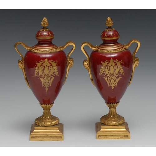 528 - A pair of 19th century pedestal ovoid two handled gilt metal mounted vases, turquoise and white seed... 