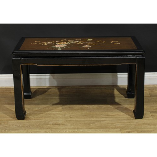 1020 - A Chinese black japanned waisted coffee or tea table, rectangular top decorated with a bird and blos... 