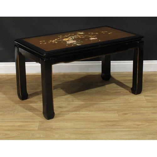 1020 - A Chinese black japanned waisted coffee or tea table, rectangular top decorated with a bird and blos... 