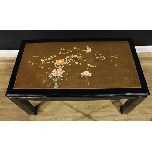 1020 - A Chinese black japanned waisted coffee or tea table, rectangular top decorated with a bird and blos... 