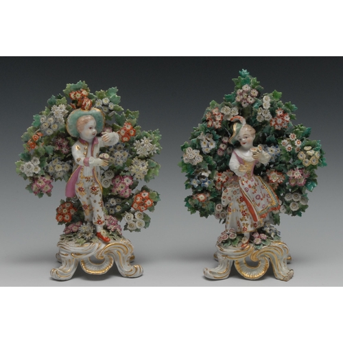 398 - A pair of Bow figures, of the New Dancers,  the young couple standing in typical animated poses,  be... 