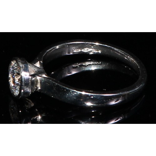 354 - A platinum diamond solitaire ring, approx. 0.6ct, size J, marked 950, 3.85g