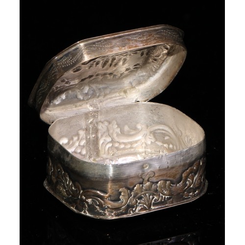 318 - A continental silver canted rectangular snuff box, embossed in low relief with cattle and other rura... 