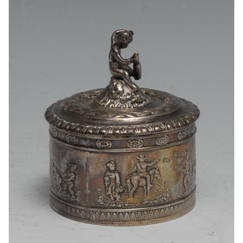 826 - An early 20th century German silver cylindrical table snuff box, the domed cover surmounted with a r... 