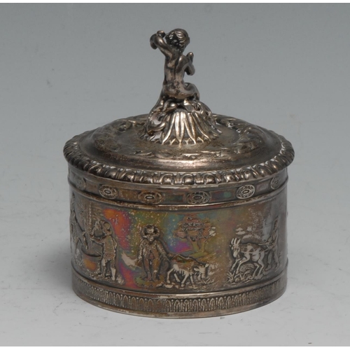 826 - An early 20th century German silver cylindrical table snuff box, the domed cover surmounted with a r... 