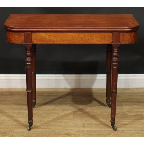 935 - A 19th century mahogany tea table, hinged top, ring-turned legs, brass casters, 74.5cm high, 91.5cm ... 