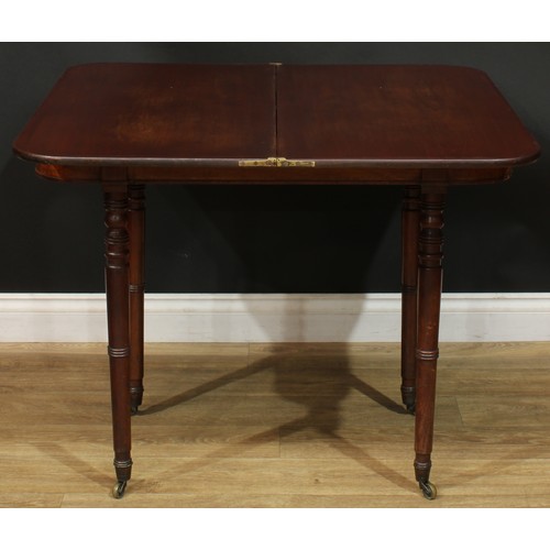 935 - A 19th century mahogany tea table, hinged top, ring-turned legs, brass casters, 74.5cm high, 91.5cm ... 