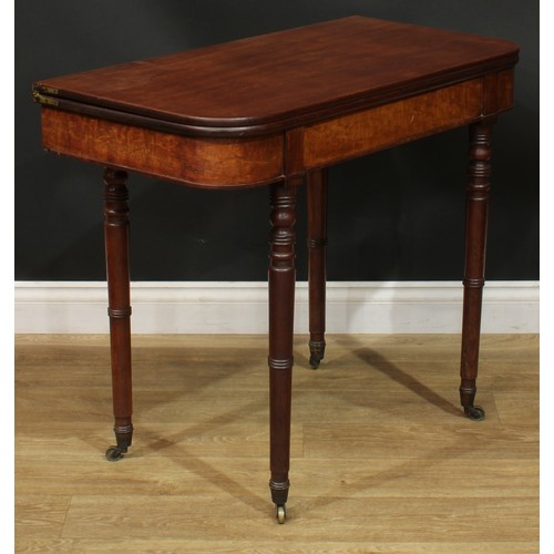 935 - A 19th century mahogany tea table, hinged top, ring-turned legs, brass casters, 74.5cm high, 91.5cm ... 