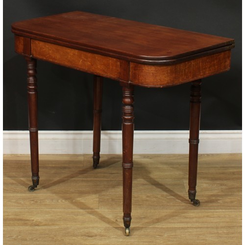 935 - A 19th century mahogany tea table, hinged top, ring-turned legs, brass casters, 74.5cm high, 91.5cm ... 