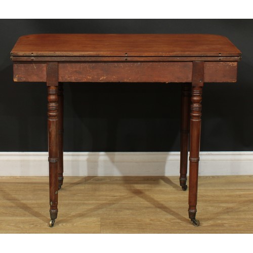 935 - A 19th century mahogany tea table, hinged top, ring-turned legs, brass casters, 74.5cm high, 91.5cm ... 