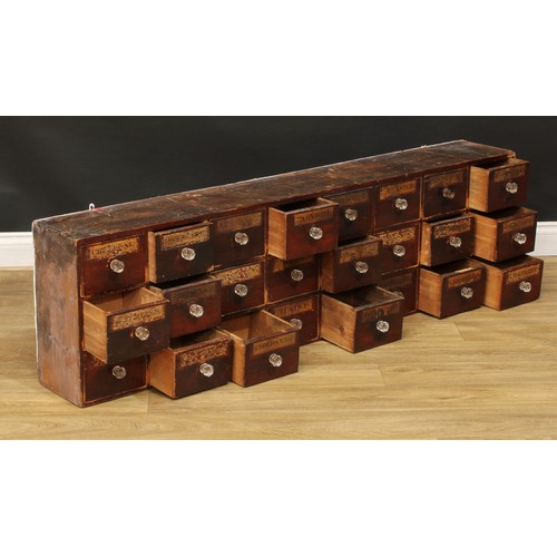 1324 - A late 19th century medicine or apothecary chest, of twenty-four drawers, each labelled, faceted gla... 