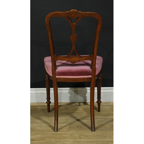 1123 - A set of four late Victorian walnut drawing room side chairs, each cresting rail, splat and bar carv... 