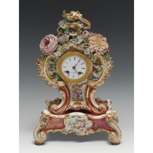 986 - A French Rococo Revival porcelain cartouche shaped mantel clock, 6cm circular enamel dial inscribed ... 