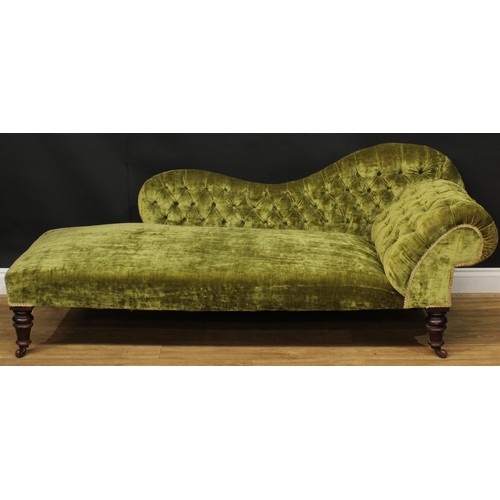 1457 - A Victorian chaise longue, stuffed-over upholstery, deep-button back and side, turned legs, ceramic ... 