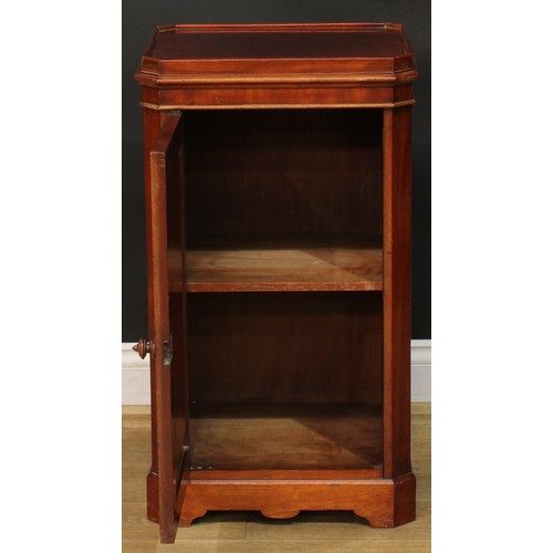 912 - A 19th century mahogany bedroom pedestal, canted rectangular top with moulded edge above a panel doo... 