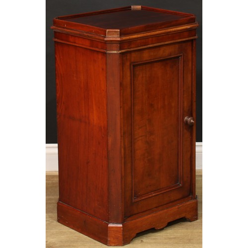 912 - A 19th century mahogany bedroom pedestal, canted rectangular top with moulded edge above a panel doo... 