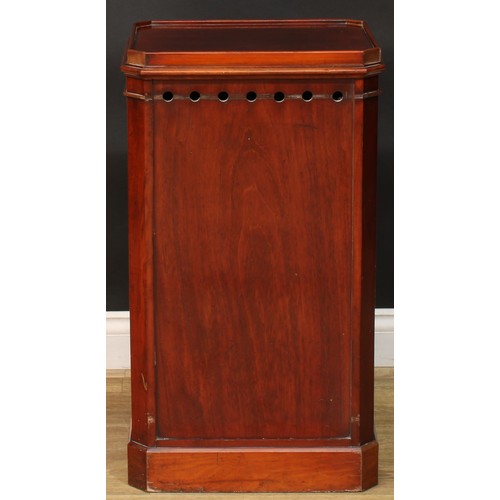 912 - A 19th century mahogany bedroom pedestal, canted rectangular top with moulded edge above a panel doo... 