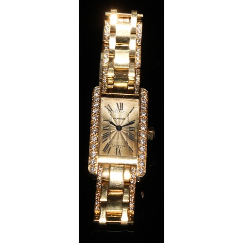 331 - A lady's 18ct gold and diamond Cartier watch, champagne dial with Roman numerals, the case 35mm x 20... 