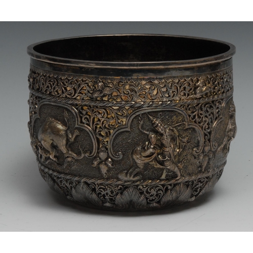 81 - A Burmese silver bowl, of double-walled construction, the outer pierced and chased with animals and ... 