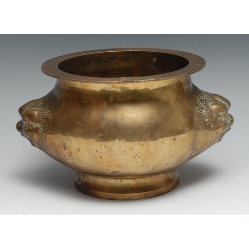 762 - A Chinese gilt bronze censer, cast with masks, 18cm diam