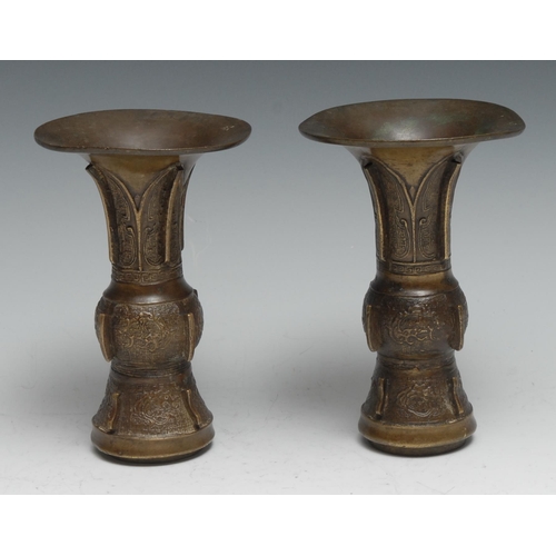 804 - A pair of Chinese bronze gu vases, cast in the archaic taste, 15cm high, 19th century