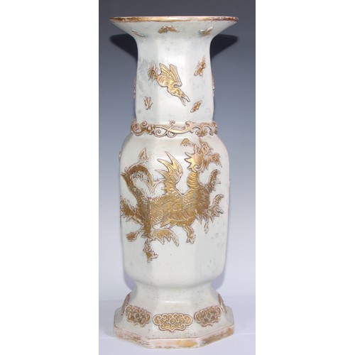 447 - A pair of large Ironstone vases, each moulded and picked out in gilt in the Chinese taste with drago... 