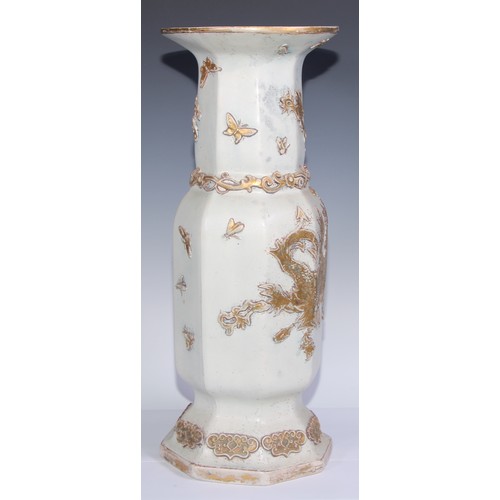 447 - A pair of large Ironstone vases, each moulded and picked out in gilt in the Chinese taste with drago... 