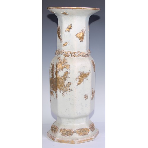 447 - A pair of large Ironstone vases, each moulded and picked out in gilt in the Chinese taste with drago... 