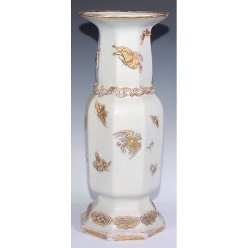 447 - A pair of large Ironstone vases, each moulded and picked out in gilt in the Chinese taste with drago... 