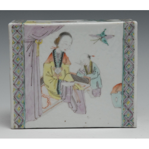 752 - A Chinese pillow, painted in polychrome with  a lady of the court and a young boy attendant, diaper ... 