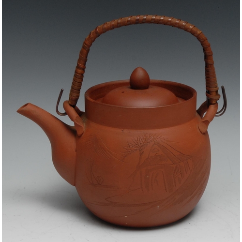 769 - A Japanese Yixing type terracotta kettle and stand, 30cm high overall