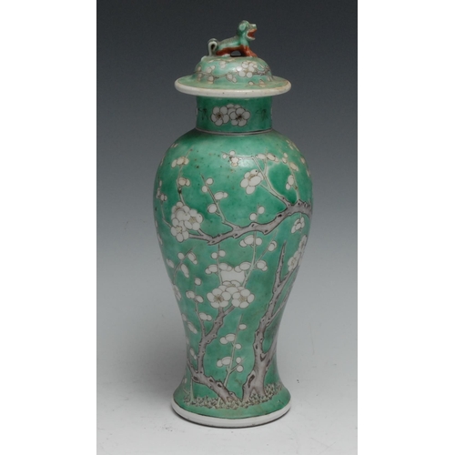 736 - A Chinese baluster vase and cover, painted with blossoming prunus on a green ground, 28.5cm high, 19... 