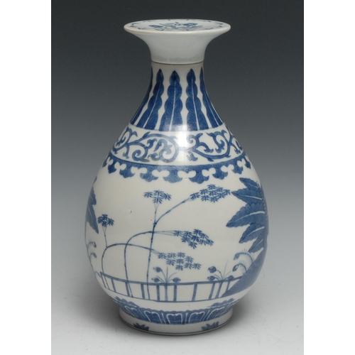 750 - A Chinese ovoid wine vase, decorated in tones of underglaze blue with flowers and trees, bayonet cov... 