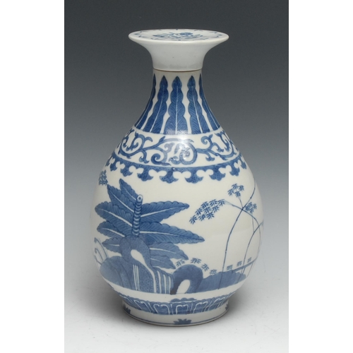 750 - A Chinese ovoid wine vase, decorated in tones of underglaze blue with flowers and trees, bayonet cov... 