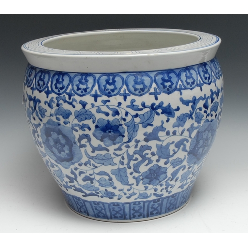 748 - A Chinese ovoid fish bowl, painted in tones of underglaze blue with flowers and scrolling leaves, be... 