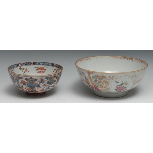 792 - An 18th century Chinese punch bowl painted in the famille rose palette with figures, flowers and lan... 