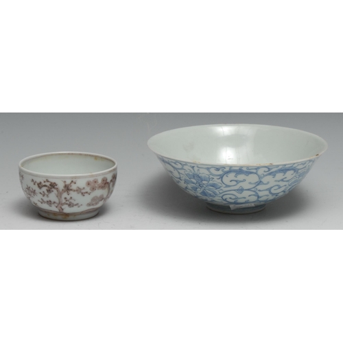 745 - A Chinese flared circular bowl, painted in tones of underglaze blue with chrysanthemums and scrollin... 