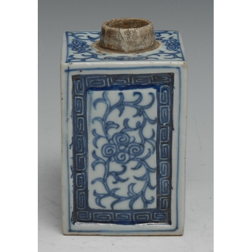 793 - An 18th century Chinese square tea caddy, painted in tones of underglaze blue with scrolling foliage... 