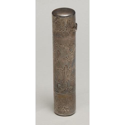 221 - A Victorian Aesthetic Movement silver cylindrical double-ended scent bottle, engraved in the manner ... 