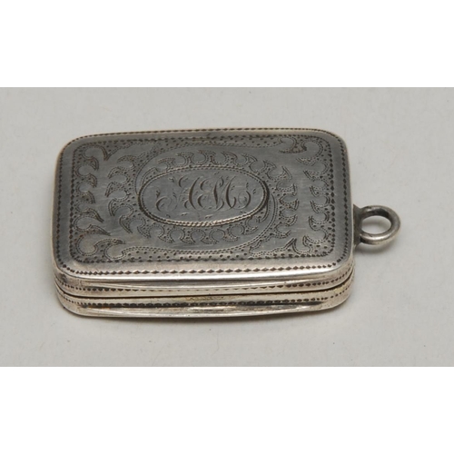 129 - A George III silver rounded rectangular vinaigrette, hinged cover wrigglework engraved with stylised... 