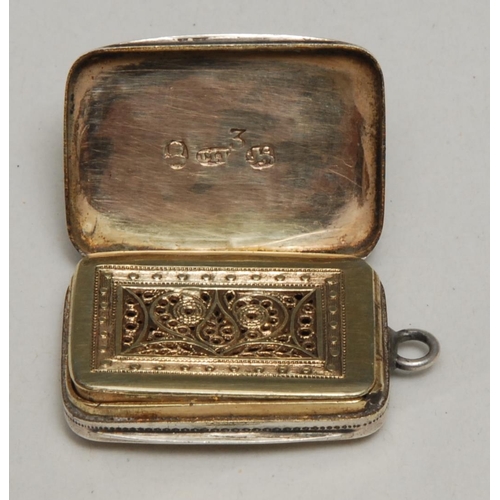 129 - A George III silver rounded rectangular vinaigrette, hinged cover wrigglework engraved with stylised... 