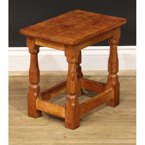 1631 - Mouseman of Kilburn - an oak joint stool, rectangular top, slightly outswept turned and panelled leg... 