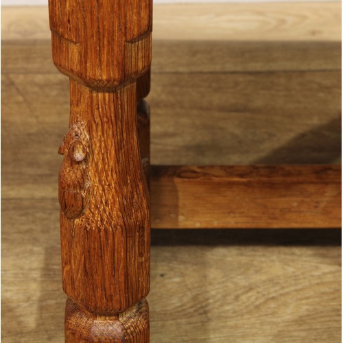 1631 - Mouseman of Kilburn - an oak joint stool, rectangular top, slightly outswept turned and panelled leg... 