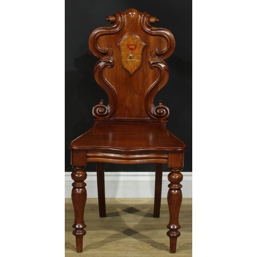 1407 - A pair of Victorian armorial hall chairs, cartouche shaped back applied with polychrome painted cres... 